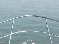 A boat, two guys and a willing blonde.