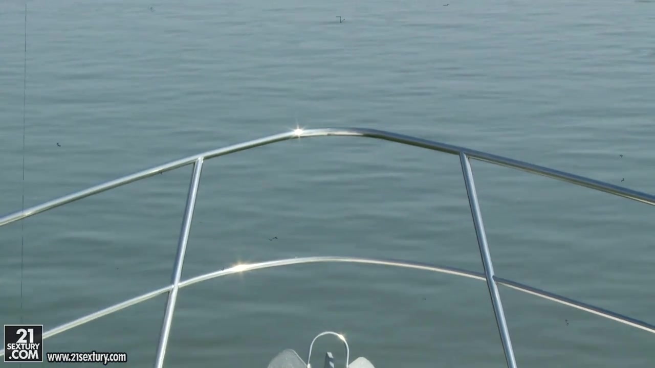 A boat, two guys and a willing blonde.